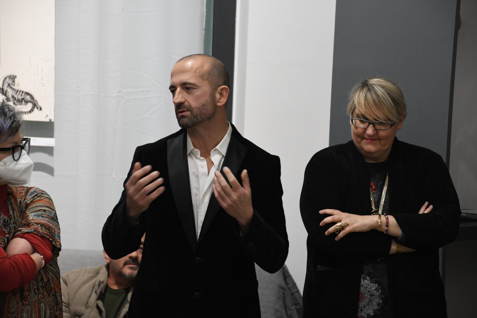 The artist speaking during the exhibition